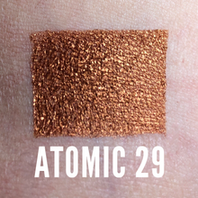 Load image into Gallery viewer, Metallic copper eyeshadow swatch on light to medium skin tone

