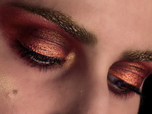 Load image into Gallery viewer, Woman with dramatic eye makeup in copper hues
